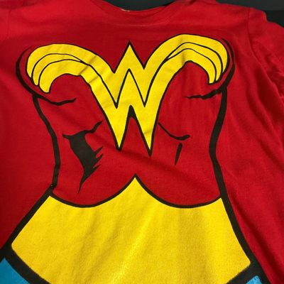 LOT 76: Marvels Captain America Shield Backpack with Wonder Woman Costume (Cape, Shirt and Headband Only)