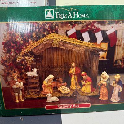 LOT 24: Holiday Novels by Mary Higgens Clark and John Grisham, Nativity Set In Original Box, Metal Church Candle Holder and More
