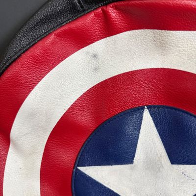 LOT 76: Marvels Captain America Shield Backpack with Wonder Woman Costume (Cape, Shirt and Headband Only)