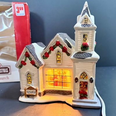 LOT 24: Holiday Novels by Mary Higgens Clark and John Grisham, Nativity Set In Original Box, Metal Church Candle Holder and More