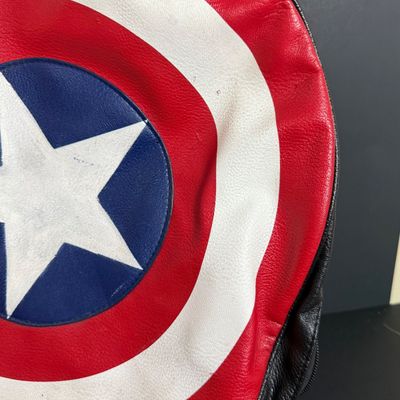 LOT 76: Marvels Captain America Shield Backpack with Wonder Woman Costume (Cape, Shirt and Headband Only)