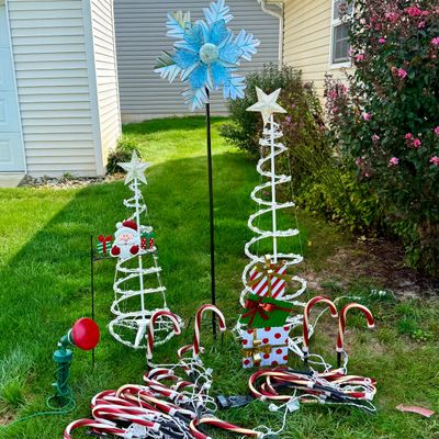 LOT 63: Assortment of Christmas Lawn Decorations Including Rope Light Christmas Trees, Candy Cane Lights. Snowflake Wind Spinner, Red...