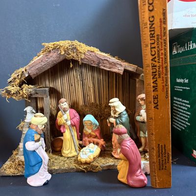 LOT 24: Holiday Novels by Mary Higgens Clark and John Grisham, Nativity Set In Original Box, Metal Church Candle Holder and More