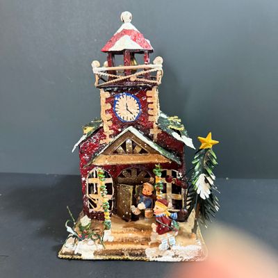 LOT 24: Holiday Novels by Mary Higgens Clark and John Grisham, Nativity Set In Original Box, Metal Church Candle Holder and More