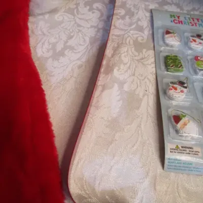 Sale Photo Thumbnail #35: 3 Furies ornaments, 1 wreath, 1 envelope/wrapping paper cutter, truck pick, 3 bead clips wreath hanger, 2  egg nativity ornaments, set of 12 miniature ornaments, Santa hat size Medium, 2 doves with a poem in a burlap bag, 1 snowflake,  see pictures