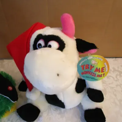 Sale Photo Thumbnail #524: The musical cow talks & sings & vibrates 3 AA batteries included, the musical penguin also dances & plays "Fireball" takes 3 AA batteries not included, See pictures
