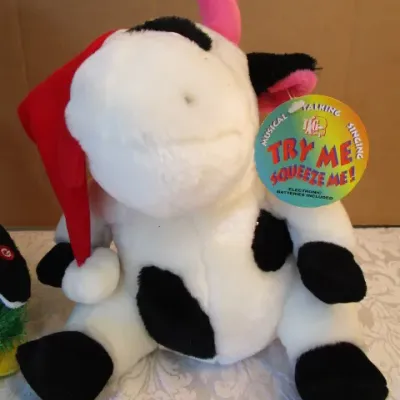 Sale Photo Thumbnail #525: The musical cow talks & sings & vibrates 3 AA batteries included, the musical penguin also dances & plays "Fireball" takes 3 AA batteries not included, See pictures