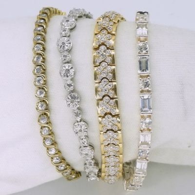 Sale Photo Thumbnail #280: Four Sterling & Gold Tone Tennis Bracelets