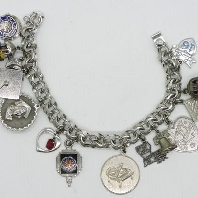 Sale Photo Thumbnail #105: Sterling, Late 1960's Charm Bracelet