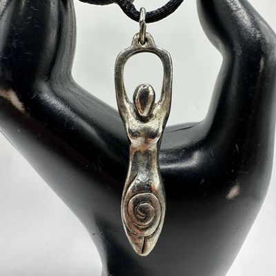 Sale Photo Thumbnail #1192: Spiral Goddess Woman Early Age Abstract Metal Pendant