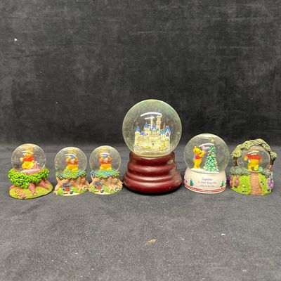 Sale Photo Thumbnail #1119: Collection of Winnie the Pooh Snow Globes Disney Cinderella Castle Collectible