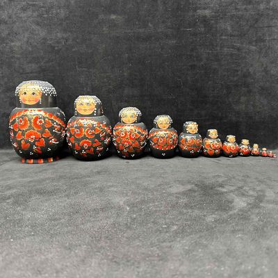Sale Photo Thumbnail #1038: Large Set of 12 Hand Painted Russian Nesting Dolls Black with Red Gold Floral Design
