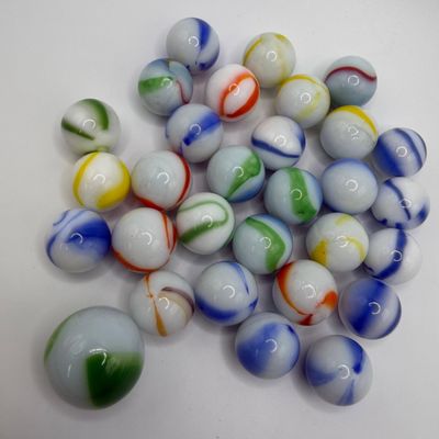 Sale Photo Thumbnail #1161: Assorted Machine Made White-based Glass Player Shooter Marbles 30 Pc