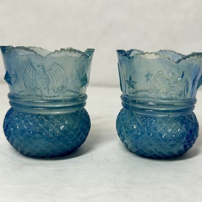 PAIR EAGLE STAR URANIUM GLASS HOLDERS