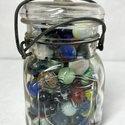 ACME VINTAGE MARBLES IN JAR