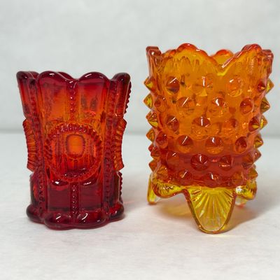TWO AMBERINA GLASS TOOTHPICK HOLDERS, MID-20TH CENTURY