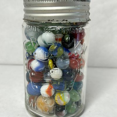 CROWN GLASS JAR AND MARBLES
