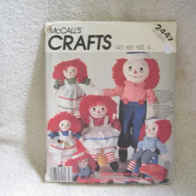 Sale Photo Thumbnail #12: Vintage 1985 McCall's Crafts sewing pattern number 2447 for Raggedy Ann and Raggedy Andy dolls. Includes patterns and instructions to make classic cloth dolls and their outfits in various sizes. Envelope shows minor wear and creasing consistent with age.