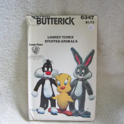 Sale Photo Thumbnail #10: Vintage Butterick sewing pattern number 6347 for Looney Tunes stuffed animals, featuring Bugs Bunny, Sylvester, and Tweety Bird. Dated 1978. One size. The envelope shows some light wear and minor creasing consistent with age, along with a small handwritte