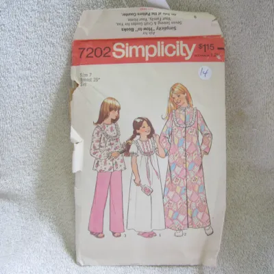 Sale Photo Thumbnail #15: Vintage Simplicity sewing pattern number 7202 for girls' sleepwear, featuring designs for a nightgown, pajamas, and robe. Size 7 (Breast 26"). The envelope shows wear, creasing, and some tearing along the left edge consistent with age and storage.
