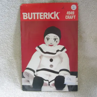 Sale Photo Thumbnail #3: Vintage Butterick sewing pattern number 4949 Craft for making a mime or Pierrot-style clown doll. The envelope shows some wear, including minor creasing, a handwritten number at the top right, and a small price sticker at the bottom right. Pattern pieces 