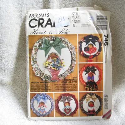 Sale Photo Thumbnail #52: Vintage McCall's Crafts sewing pattern number 746, 'Heart & Sole' Holiday Wreaths. Features patterns and instructions to make decorative wreaths for Halloween, Thanksgiving, Christmas, Valentine's Day, Spring, and the 4th of July. The paper envelope shows