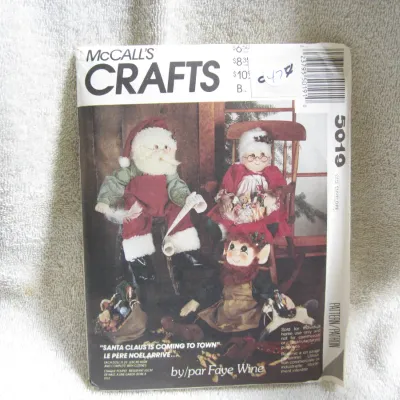 Sale Photo Thumbnail #48: Vintage McCall's Crafts sewing pattern number 5019, designed by Faye Wine. Features patterns and instructions to make 26-inch (65cm) tall 'Santa Claus is Coming to Town' dolls, including Santa, Mrs. Claus, and an elf, complete with clothes. The envelope s