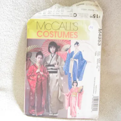 Sale Photo Thumbnail #20: McCall's Costumes sewing pattern M4953 for girls' Japanese-style kimonos. Designed for girls' sizes 7-14. The envelope shows some wear, creasing, and minor tearing at the top edge, but remains intact. Ideal for crafting, cosplay, or theatrical costumes.