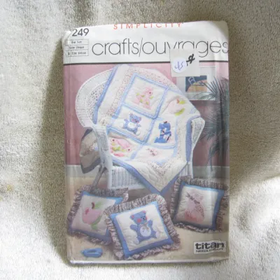 Sale Photo Thumbnail #46: Vintage Simplicity sewing pattern number 249 for Titan Needlecraft crafts. Features designs for a baby quilt and decorative pillows with animal and alphabet motifs. One size. The envelope shows light wear and has a handwritten price marking on the front. 