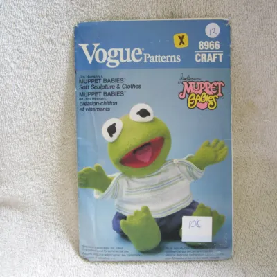 Sale Photo Thumbnail #13: Vintage 1984 Vogue Patterns craft sewing pattern number 8966 for Jim Henson's Muppet Babies Kermit soft sculpture doll and clothes. The envelope shows some wear, creasing, and handwritten markings/stickers consistent with age. Pattern completeness is unte