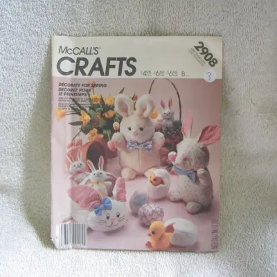 Sale Photo Thumbnail #4: Vintage McCall's Crafts sewing pattern number 2908. Features instructions and templates to make stuffed bunnies in two sizes, a chick in a hatched egg, a bunny basket, and an Easter egg. The envelope shows some light wear and has a handwritten marking on 