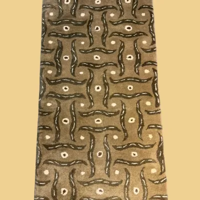 Unique gold and brown rug featuring a bold abstract repeating design. A distinctive piece for an eclectic, bohemian, or contemporary...