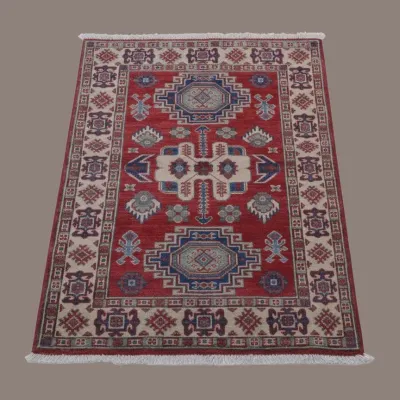 Red, ivory, and blue geometric rug featuring bold traditional motifs, multiple medallions, and a richly detailed patterned border.