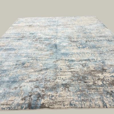 Soft blue distressed-style rug featuring subtle abstract texture and a gently faded appearance for a relaxed transitional look.