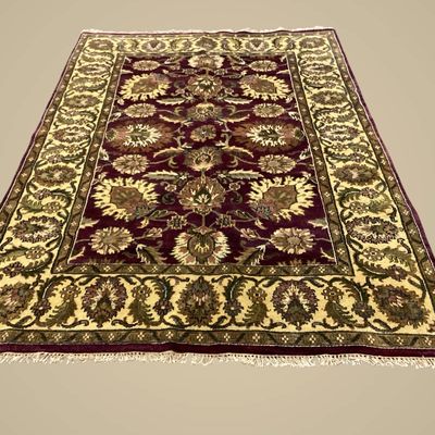 Rich burgundy, gold, and olive floral rug featuring a classic traditional pattern with dense botanical detailing.