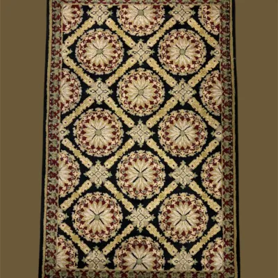 Blue and gold geometric rug featuring repeating diamond-style medallions and intricate botanical-inspired detailing.