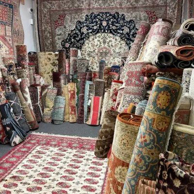 Extensive assortment of rolled handmade rugs featuring traditional, floral, geometric, and contemporary designs. Many sizes and color...