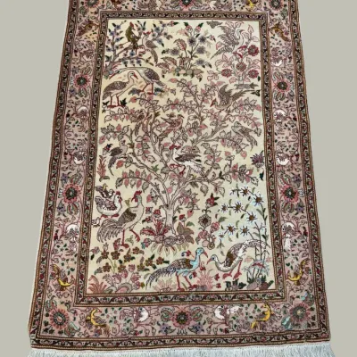 Elegant neutral-toned traditional rug with a detailed floral pattern in soft ivory, beige, burgundy, and muted accent colors.