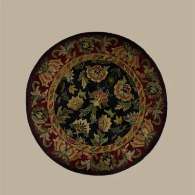 Round black rug featuring an elegant floral design with gold, green, blue, and muted red botanical accents.