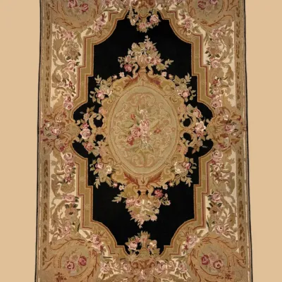 Dramatic black and gold traditional rug featuring an elaborate central medallion surrounded by ornate floral detailing.