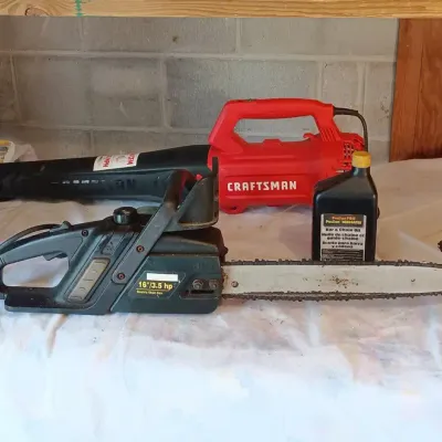 Power Tools - Craftsman Blower, Chainsaw. Braun Light