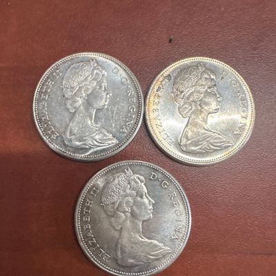 Three Canadian Silver Dollar Coins