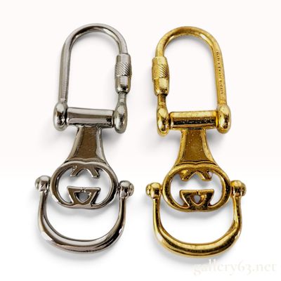 Sale Photo Thumbnail #147: Two Vintage Gucci Interlocking G Metal Keychains with Box