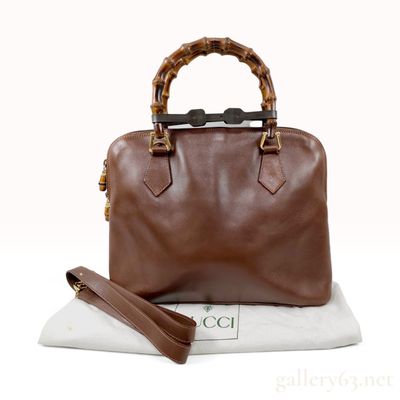 Sale Photo Thumbnail #125: Vintage Gucci Bamboo Top Handle Brown Leather Bag with Strap and Dust Bag