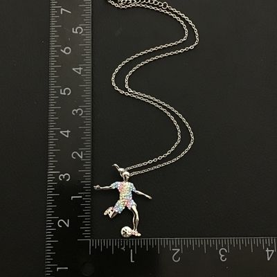 Stylish silver tone women’s soccer player pendant necklace