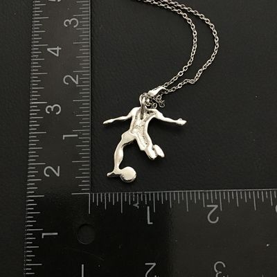 Stylish silver tone women’s soccer player pendant necklace