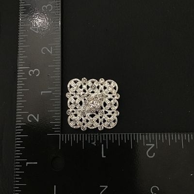 Pretty silver tone fashion brooch