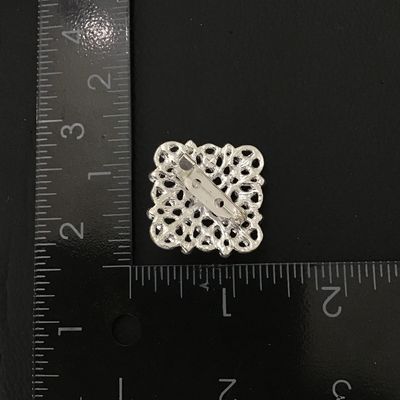Pretty silver tone fashion brooch
