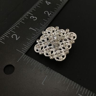 Pretty silver tone fashion brooch