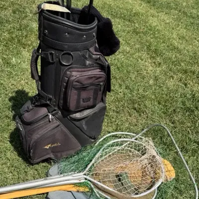 Golf Bag with Clubs and Fishing Nets Plus Paddle